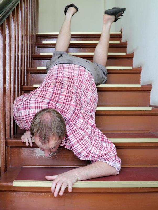 man-in-checkered-shirt-falling-down-stairs